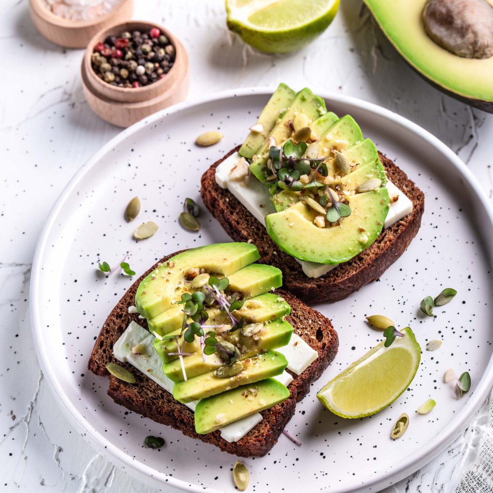 sandwiches with avocado, cheese, pumpkin, nut and sesame. banner, catering menu recipe vertical image